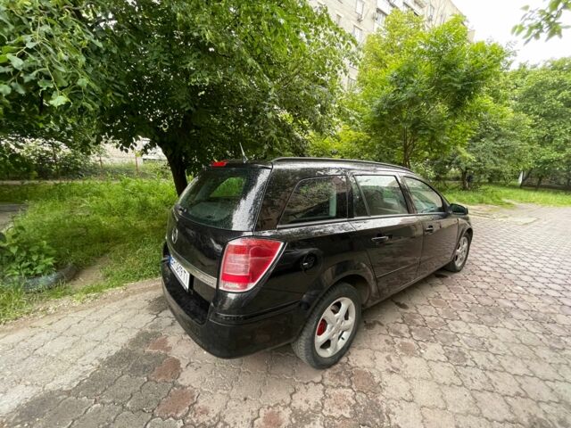 Черный Опель Астра, объемом двигателя 1.6 л и пробегом 264 тыс. км за 5000 $, фото 3 на Automoto.ua