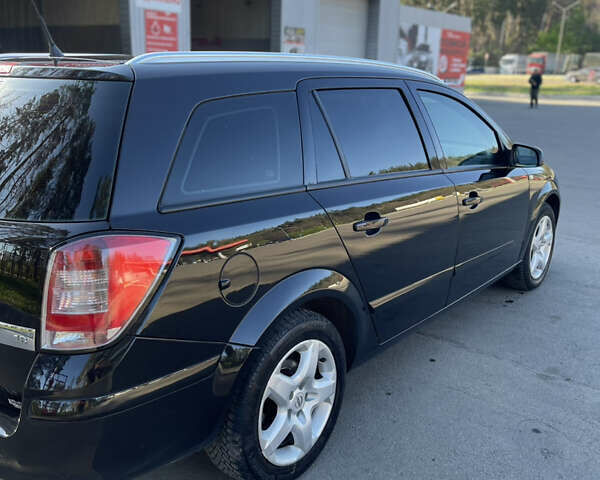 Черный Опель Астра, объемом двигателя 1.8 л и пробегом 226 тыс. км за 5390 $, фото 7 на Automoto.ua