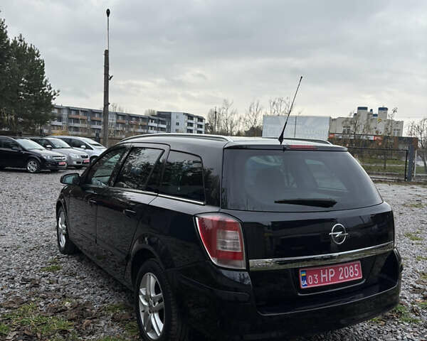 Черный Опель Астра, объемом двигателя 1.6 л и пробегом 208 тыс. км за 5600 $, фото 12 на Automoto.ua