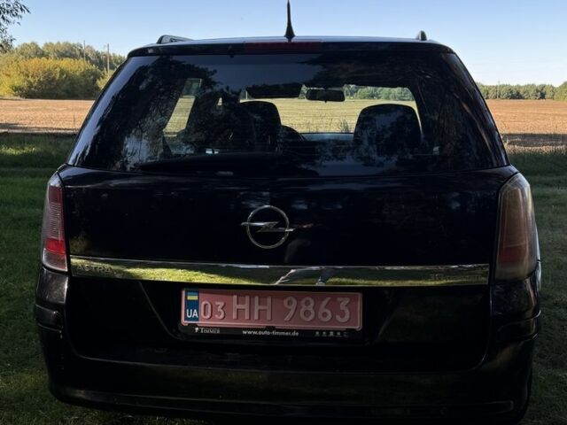 Черный Опель Астра, объемом двигателя 1.6 л и пробегом 228 тыс. км за 4450 $, фото 7 на Automoto.ua