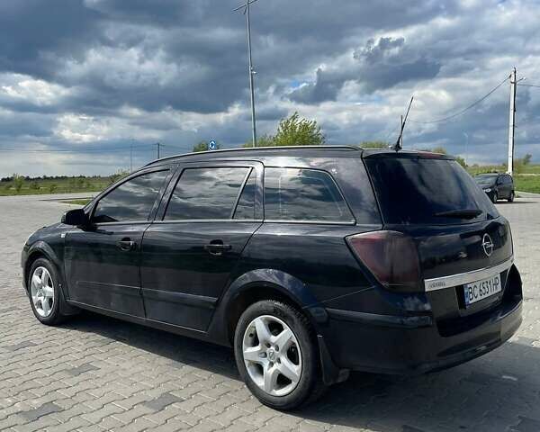 Черный Опель Астра, объемом двигателя 1.91 л и пробегом 242 тыс. км за 4500 $, фото 5 на Automoto.ua