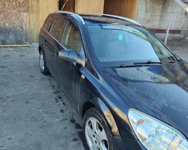 Черный Опель Астра, объемом двигателя 1.9 л и пробегом 294 тыс. км за 4000 $, фото 2 на Automoto.ua