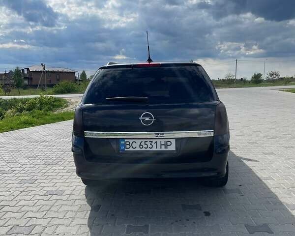 Черный Опель Астра, объемом двигателя 1.91 л и пробегом 242 тыс. км за 4500 $, фото 6 на Automoto.ua