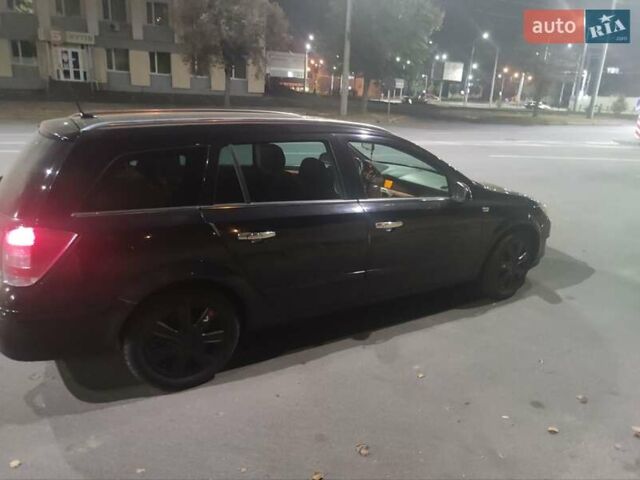 Черный Опель Астра, объемом двигателя 1.9 л и пробегом 260 тыс. км за 5800 $, фото 5 на Automoto.ua