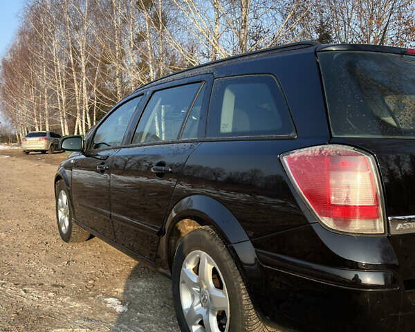 Черный Опель Астра, объемом двигателя 1.69 л и пробегом 270 тыс. км за 5500 $, фото 5 на Automoto.ua