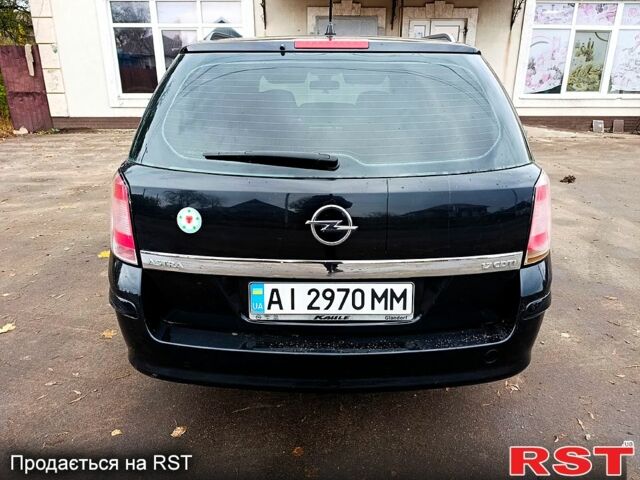Черный Опель Астра, объемом двигателя 1.7 л и пробегом 300 тыс. км за 5250 $, фото 4 на Automoto.ua