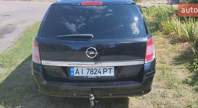Черный Опель Астра, объемом двигателя 1.6 л и пробегом 243 тыс. км за 4500 $, фото 33 на Automoto.ua