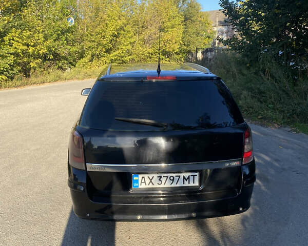Черный Опель Астра, объемом двигателя 1.69 л и пробегом 304 тыс. км за 3500 $, фото 4 на Automoto.ua