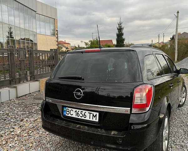 Черный Опель Астра, объемом двигателя 1.9 л и пробегом 254 тыс. км за 5100 $, фото 7 на Automoto.ua