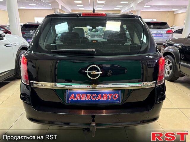 Черный Опель Астра, объемом двигателя 1.4 л и пробегом 210 тыс. км за 5600 $, фото 4 на Automoto.ua