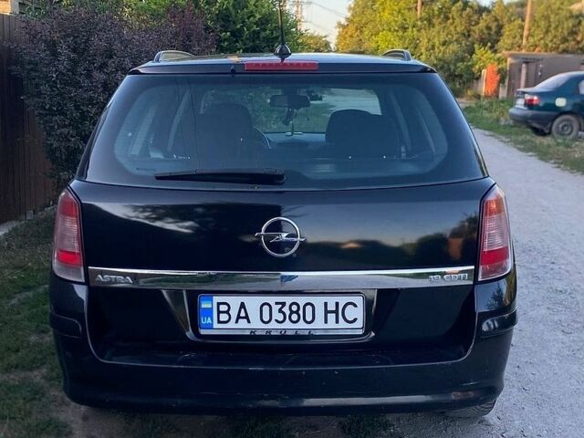 Черный Опель Астра, объемом двигателя 1.91 л и пробегом 246 тыс. км за 4500 $, фото 13 на Automoto.ua