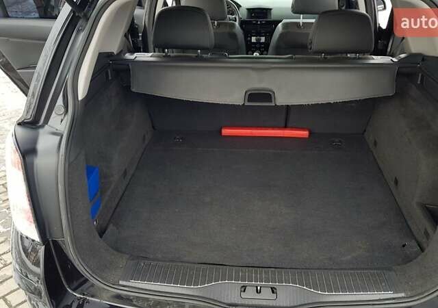 Черный Опель Астра, объемом двигателя 1.7 л и пробегом 332 тыс. км за 5599 $, фото 22 на Automoto.ua