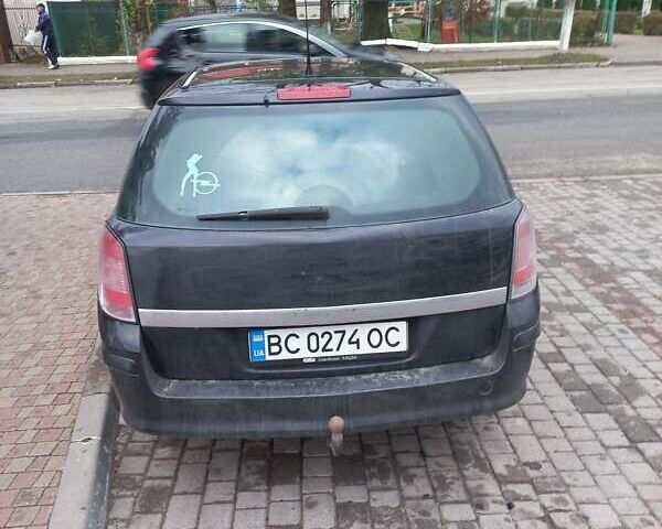Черный Опель Астра, объемом двигателя 1.7 л и пробегом 330 тыс. км за 5800 $, фото 3 на Automoto.ua