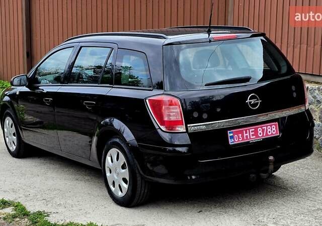 Черный Опель Астра, объемом двигателя 1.6 л и пробегом 238 тыс. км за 6299 $, фото 25 на Automoto.ua