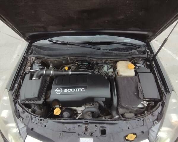 Черный Опель Астра, объемом двигателя 1.25 л и пробегом 325 тыс. км за 4699 $, фото 15 на Automoto.ua