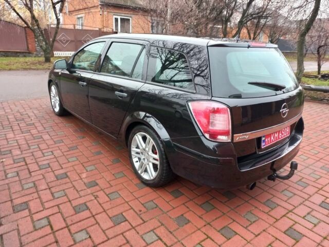 Черный Опель Астра, объемом двигателя 1.8 л и пробегом 200 тыс. км за 5750 $, фото 6 на Automoto.ua