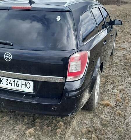 Черный Опель Астра, объемом двигателя 1.9 л и пробегом 266 тыс. км за 5550 $, фото 3 на Automoto.ua