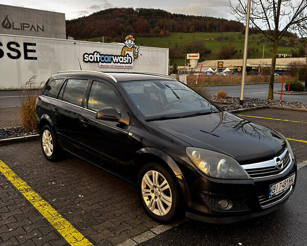 Черный Опель Астра, объемом двигателя 1.69 л и пробегом 268 тыс. км за 8000 $, фото 2 на Automoto.ua