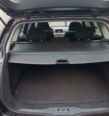 Черный Опель Астра, объемом двигателя 1.6 л и пробегом 249 тыс. км за 5650 $, фото 10 на Automoto.ua