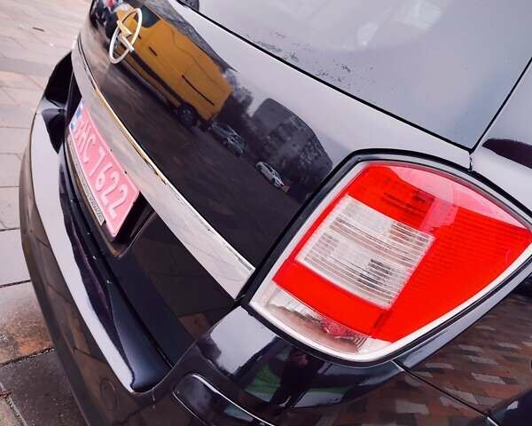 Черный Опель Астра, объемом двигателя 1.6 л и пробегом 212 тыс. км за 5750 $, фото 9 на Automoto.ua