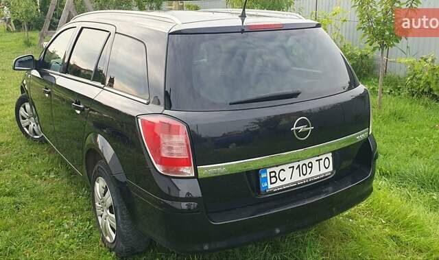 Черный Опель Астра, объемом двигателя 1.4 л и пробегом 150 тыс. км за 6100 $, фото 1 на Automoto.ua