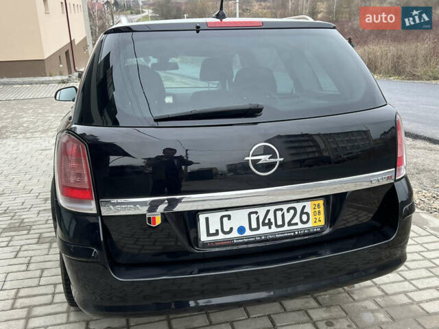 Черный Опель Астра, объемом двигателя 1.7 л и пробегом 264 тыс. км за 5799 $, фото 21 на Automoto.ua