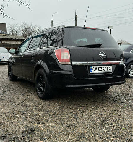 Черный Опель Астра, объемом двигателя 1.69 л и пробегом 242 тыс. км за 6200 $, фото 3 на Automoto.ua