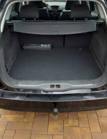 Черный Опель Астра, объемом двигателя 1.69 л и пробегом 252 тыс. км за 5600 $, фото 3 на Automoto.ua