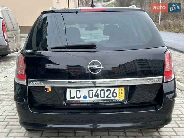 Черный Опель Астра, объемом двигателя 1.7 л и пробегом 264 тыс. км за 5799 $, фото 22 на Automoto.ua