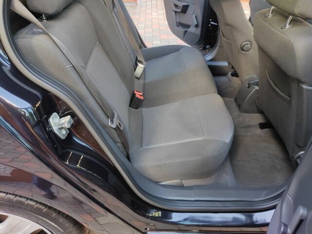 Черный Опель Астра, объемом двигателя 1.4 л и пробегом 215 тыс. км за 5900 $, фото 23 на Automoto.ua