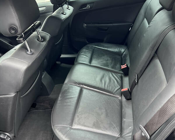 Черный Опель Астра, объемом двигателя 1.6 л и пробегом 250 тыс. км за 5600 $, фото 11 на Automoto.ua