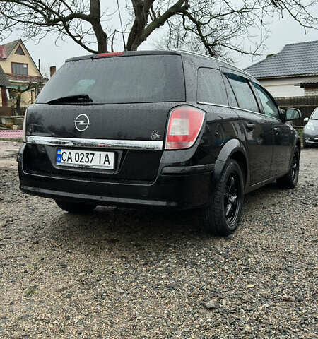 Черный Опель Астра, объемом двигателя 1.69 л и пробегом 242 тыс. км за 6200 $, фото 7 на Automoto.ua