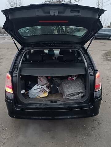 Черный Опель Астра, объемом двигателя 1.69 л и пробегом 246 тыс. км за 6500 $, фото 12 на Automoto.ua
