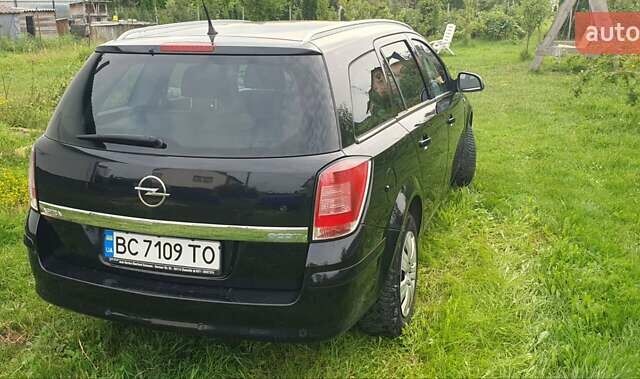 Черный Опель Астра, объемом двигателя 1.4 л и пробегом 150 тыс. км за 6100 $, фото 6 на Automoto.ua