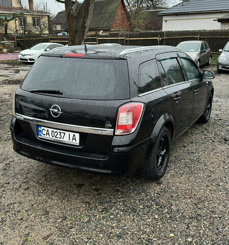 Черный Опель Астра, объемом двигателя 1.69 л и пробегом 242 тыс. км за 6200 $, фото 6 на Automoto.ua