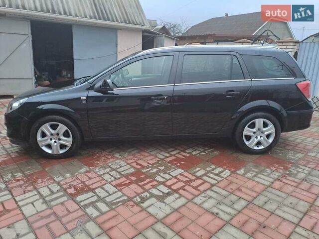 Черный Опель Астра, объемом двигателя 1.6 л и пробегом 209 тыс. км за 5800 $, фото 5 на Automoto.ua