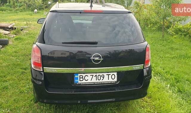Черный Опель Астра, объемом двигателя 1.4 л и пробегом 150 тыс. км за 6100 $, фото 4 на Automoto.ua