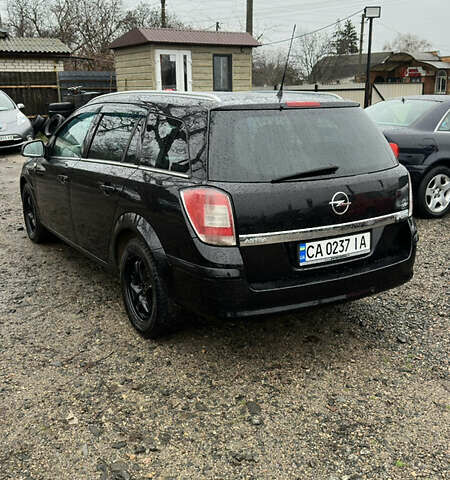 Черный Опель Астра, объемом двигателя 1.69 л и пробегом 242 тыс. км за 6200 $, фото 4 на Automoto.ua