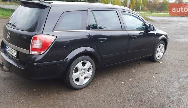 Черный Опель Астра, объемом двигателя 1.69 л и пробегом 252 тыс. км за 5600 $, фото 10 на Automoto.ua