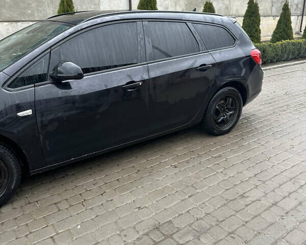 Черный Опель Астра, объемом двигателя 1.3 л и пробегом 264 тыс. км за 6500 $, фото 4 на Automoto.ua