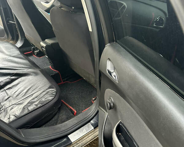 Черный Опель Астра, объемом двигателя 1.3 л и пробегом 264 тыс. км за 6500 $, фото 10 на Automoto.ua