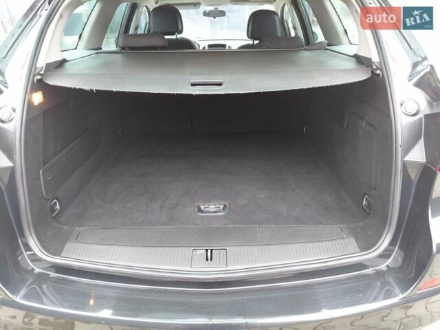 Черный Опель Астра, объемом двигателя 1.25 л и пробегом 1 тыс. км за 6200 $, фото 24 на Automoto.ua