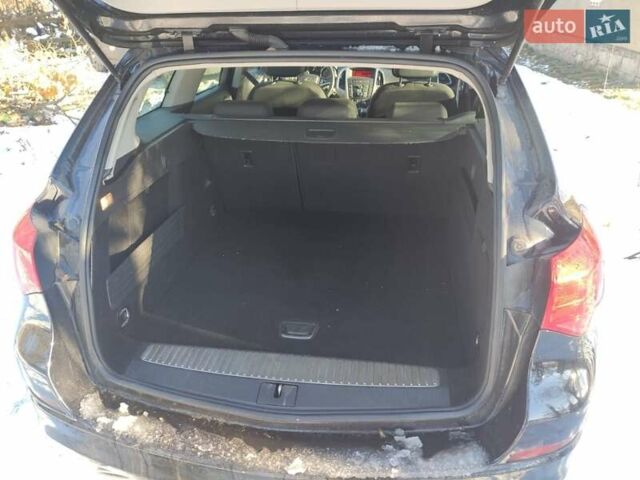 Черный Опель Астра, объемом двигателя 1.4 л и пробегом 229 тыс. км за 8760 $, фото 2 на Automoto.ua