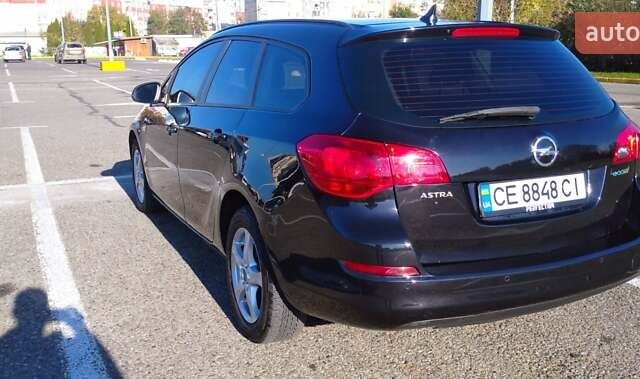 Черный Опель Астра, объемом двигателя 1.25 л и пробегом 300 тыс. км за 6500 $, фото 4 на Automoto.ua