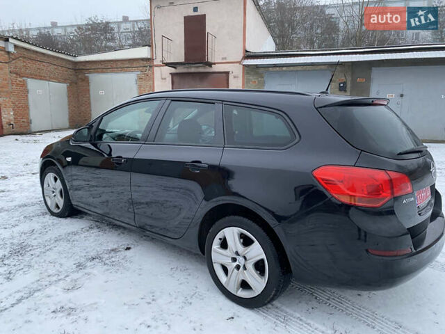 Черный Опель Астра, объемом двигателя 1.6 л и пробегом 230 тыс. км за 7300 $, фото 6 на Automoto.ua