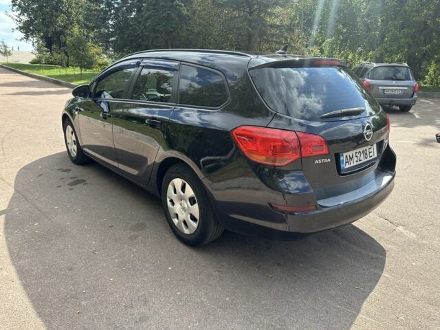 Черный Опель Астра, объемом двигателя 1.2 л и пробегом 345 тыс. км за 5950 $, фото 6 на Automoto.ua