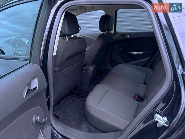 Черный Опель Астра, объемом двигателя 1.4 л и пробегом 180 тыс. км за 7500 $, фото 6 на Automoto.ua