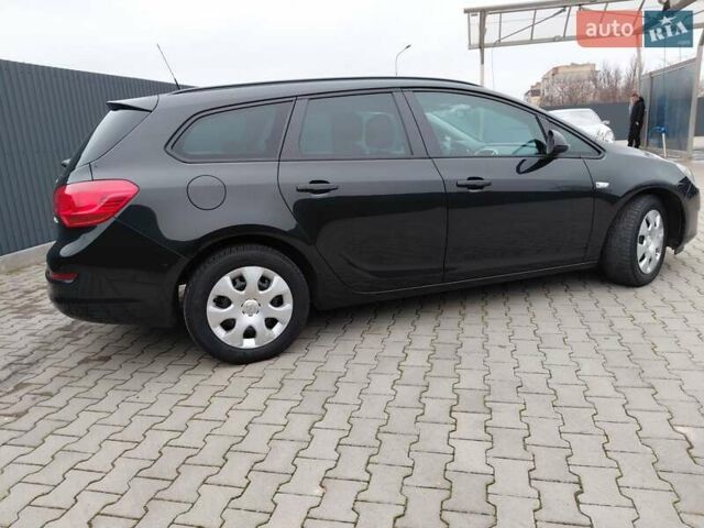 Черный Опель Астра, объемом двигателя 1.25 л и пробегом 1 тыс. км за 6200 $, фото 32 на Automoto.ua