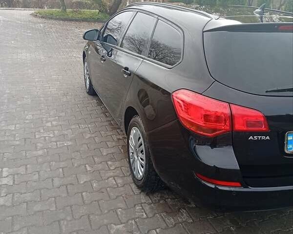Черный Опель Астра, объемом двигателя 1.7 л и пробегом 318 тыс. км за 6500 $, фото 2 на Automoto.ua