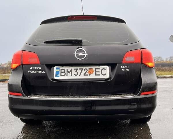 Черный Опель Астра, объемом двигателя 1.7 л и пробегом 252 тыс. км за 6850 $, фото 1 на Automoto.ua